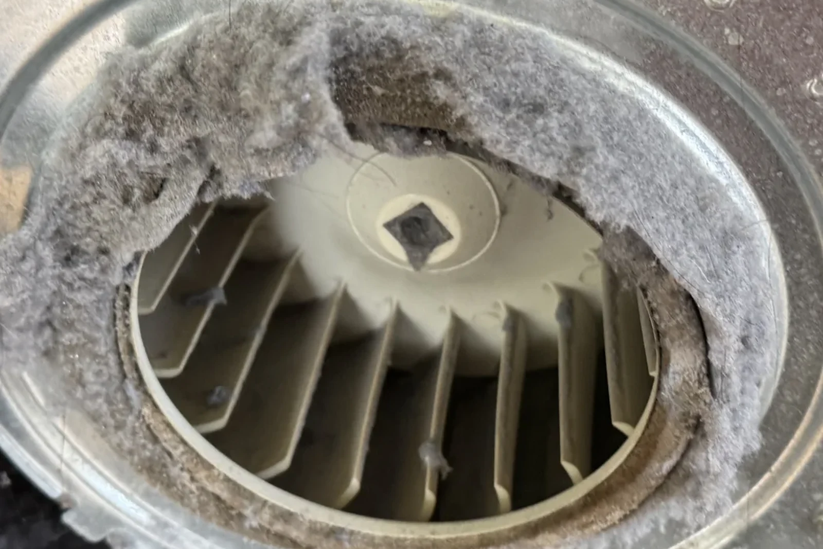 Dryer blower wheel packed with lint, restricting airflow