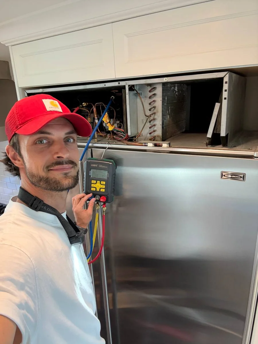 Oleg servicing a Sub-Zero refrigerator